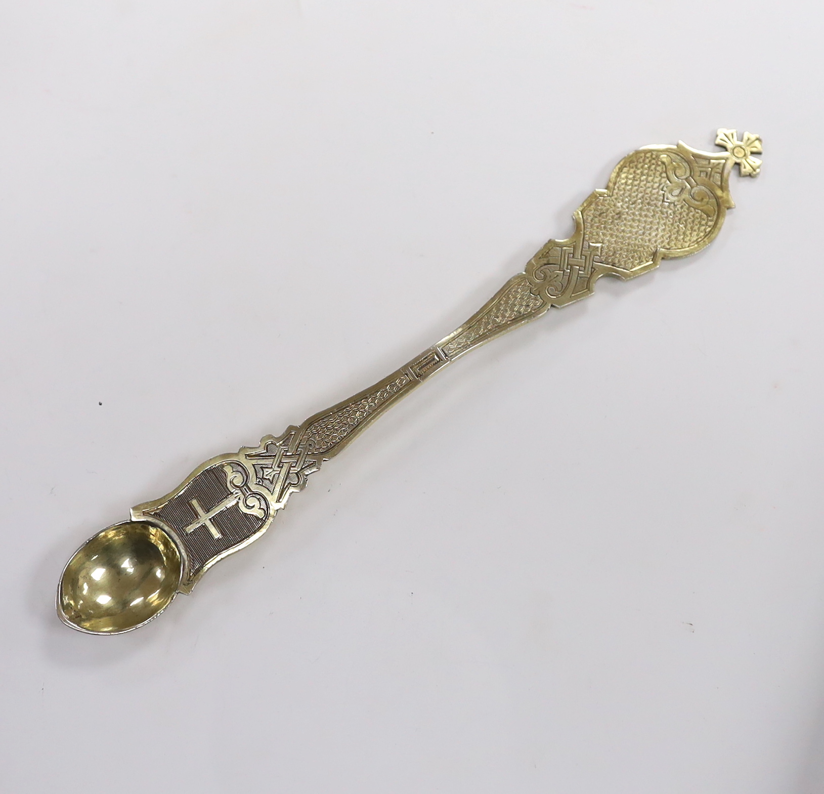 A late 19th/early 20th century Russian 84 zolotnik gilt anointing spoon, with engraved decoration, 22.9cm, 75 grams.